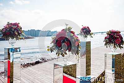 Wedding decor. Wedding registration outdoor. Luxury bouquets with red flowers Stock Photo