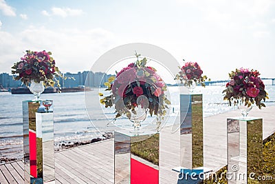 Wedding decor. Wedding registration outdoor. Luxury bouquets with red flowers Stock Photo