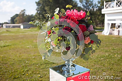 Wedding decor. Wedding registration outdoor. Luxury bouquets with red flowers Stock Photo