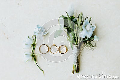 Wedding ring and flowers lay flat Stock Photo