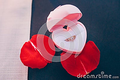 Wedding ring in a heart-shaped box. Stock Photo