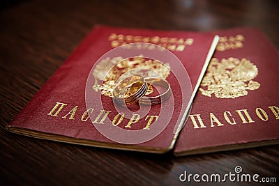 Wedding ring. Two gold vintage rings of the bride and groom and passports of the Russian Federation Stock Photo