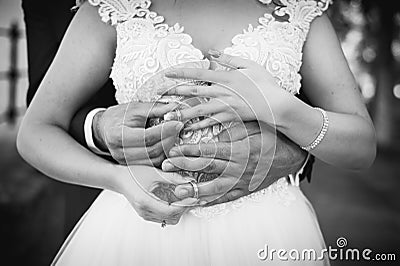 Wedding rings being exchanged closeup on the hands Stock Photo