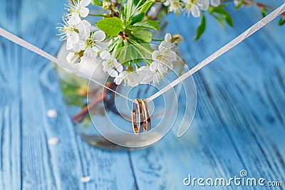 Wedding rings on a branch. Spring bouquet of cherry flowers Stock Photo