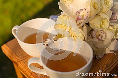 Wedding rings and bridal bouquet Stock Photo