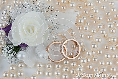 Wedding rings,flower and necklaces Stock Photo