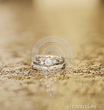 Wedding rings on gold Stock Photo