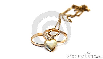 Wedding rings and golden heart Stock Photo