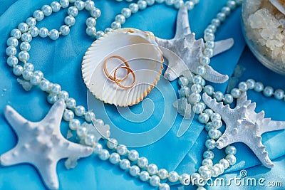 Wedding rings, nautical theme, starfish and pearl Stock Photo