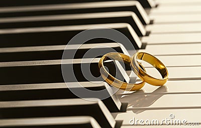 Wedding rings on piano Stock Photo