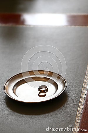 Wedding rings on a plate in the registry office Stock Photo