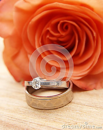 Wedding rings on a red rose Stock Photo