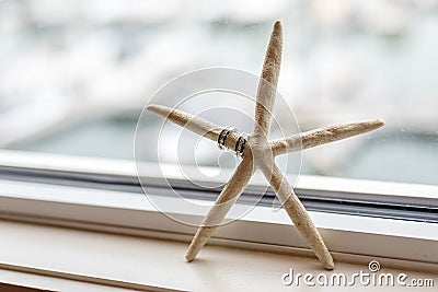 Wedding rings on Starfish Stock Photo