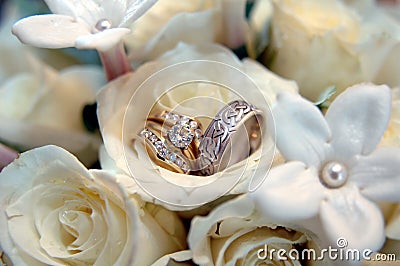 Wedding rings in white flowers Stock Photo