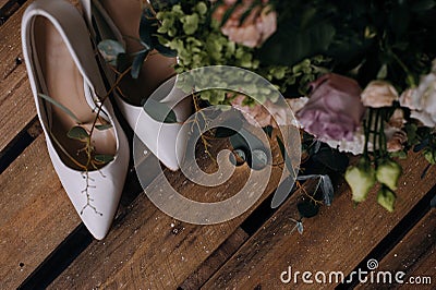 Wedding shoes and wedding gold rings Stock Photo