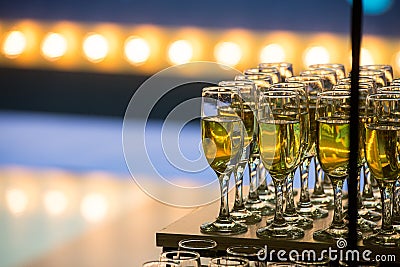 Wedding slide champagne for bride and groom indoors Stock Photo