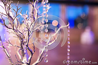 Wedding Table Arrangement - Silver Tree with Glass String Beads Stock Photo