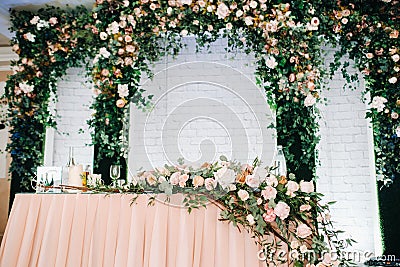 Wedding table decoration with flowers on the table in the restaurant table decor for candlelit dinner Stock Photo