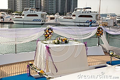 Wedding table flower settings in yacht Stock Photo