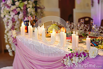 Wedding table setting, candles on the table Stock Photo