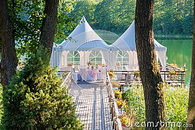 Wedding tables decorated outdoors in forest Stock Photo