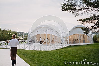 Long white tent for wedding party in the woods. Editorial Stock Photo