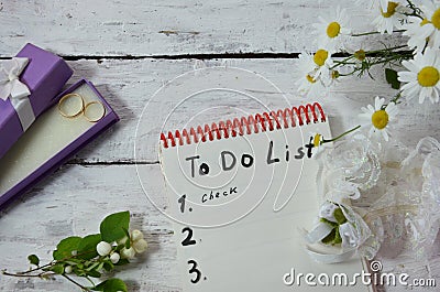 Wedding to do list top view. Present boxes, calendar for marriage planning and various bridal stuff on white rustic Stock Photo