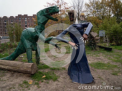 The wedding of two metallic animal-sculptures in a free urban garden Editorial Stock Photo