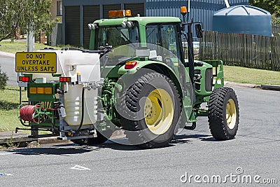 Weed spraying machine at work Editorial Stock Photo