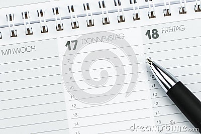 Week calendar with pen in German Stock Photo