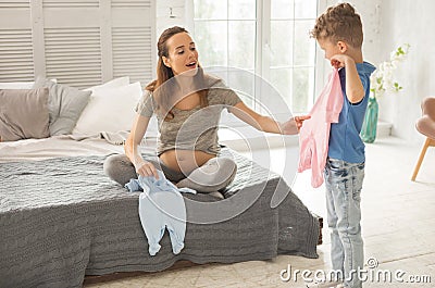 Beautiful expecting woman spending family weekend at home Stock Photo