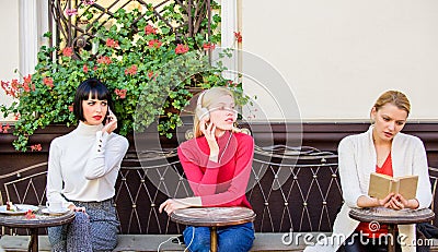 Weekend relax and leisure. Hobby and leisure. Different interests. Group pretty women cafe terrace entertain themselves Stock Photo