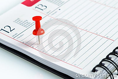 Weekly agenda with spiral and pin Stock Photo