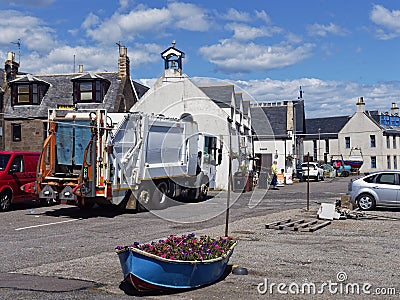 The weekly Bin Lorry doing the Refuse Collection in the small Fishing Village of Johnshaven Editorial Stock Photo