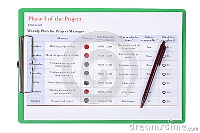 Weekly plan on green clipboard. Stock Photo