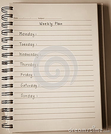 Weekly plan on notebook Stock Photo