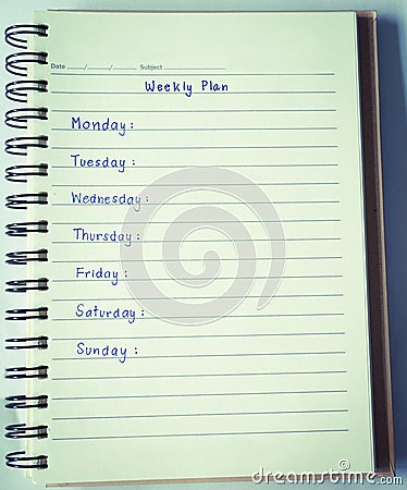 Weekly plan on notebook Stock Photo