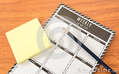 Weekly Todo List with Paper Note and Pencil Stock Photo