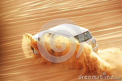 A 4-weel drive car in action in a desert safari trip in Dubai Editorial Stock Photo