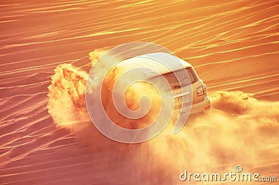 A 4-weel drive car in action in a desert safari trip in Dubai Editorial Stock Photo