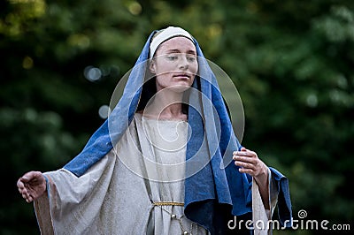 The weeping Madonna. Dutch artist performing during the International Festival of Living Statues, Bucharest, Romania, June 2017 Editorial Stock Photo