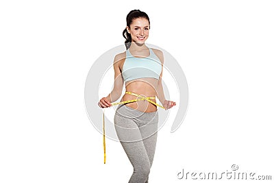 Weight loss, sports girl measuring her waist Stock Photo