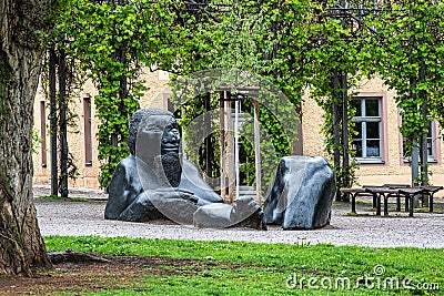 Weimar, Germany - May 11, 2023: Sunken Giant sculpture at Frauenplan park near the Goethehaus in Weimar, Germany Editorial Stock Photo