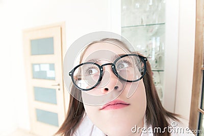 Weird funny nerdy pensive and thoughtful girl self portrait Stock Photo