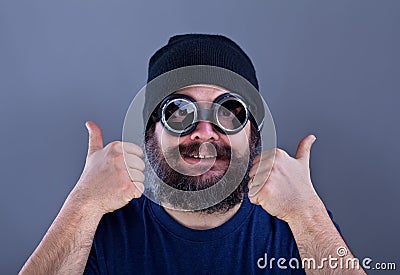 Weird man with large beard likes explosive offer Stock Photo