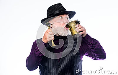 Weird old grandfather with gray beard and spider. Preparing magic Halloween drink. Halloween concept. Strange people Stock Photo