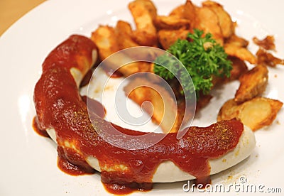 Weisswurst or German White Sausage with Curry Ketchup and Fried Potatoes Stock Photo