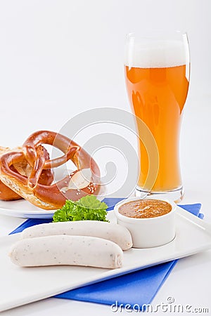 Weisswurst white sausages and sweet mustard with pretzel Stock Photo