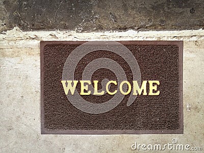 Welcome carpet gray color on old cement floor vintage background Stock Photo