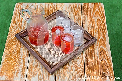 Welcome drink, Roselle juice in hotel. The detail of a wedding welcome drink, the shots with alcoholic drink. A tradition for the Stock Photo